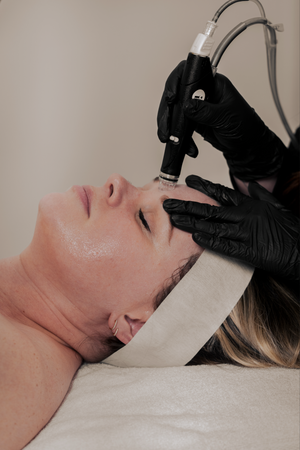 HydraFacial treatment being performed on client at Orange County medical spa