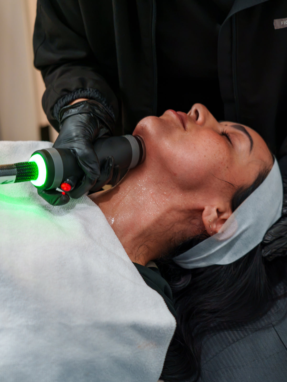 A Glow Up provider performing a skin treatment